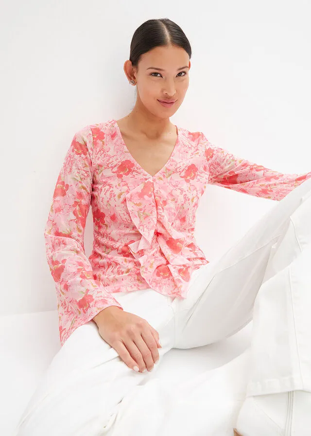 Blusa rosa pálido con flores