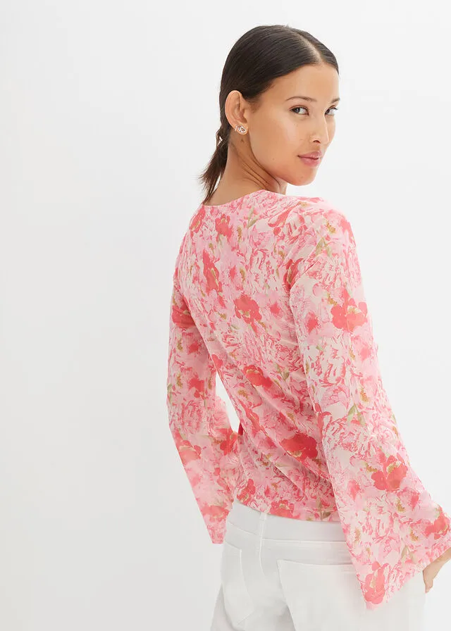 Blusa rosa pálido con flores