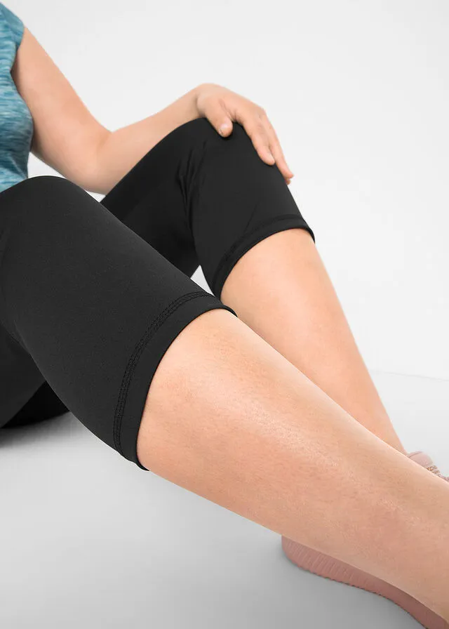 Leggings deportivos moldeadores con bolsillos, largo 3/4 Negro